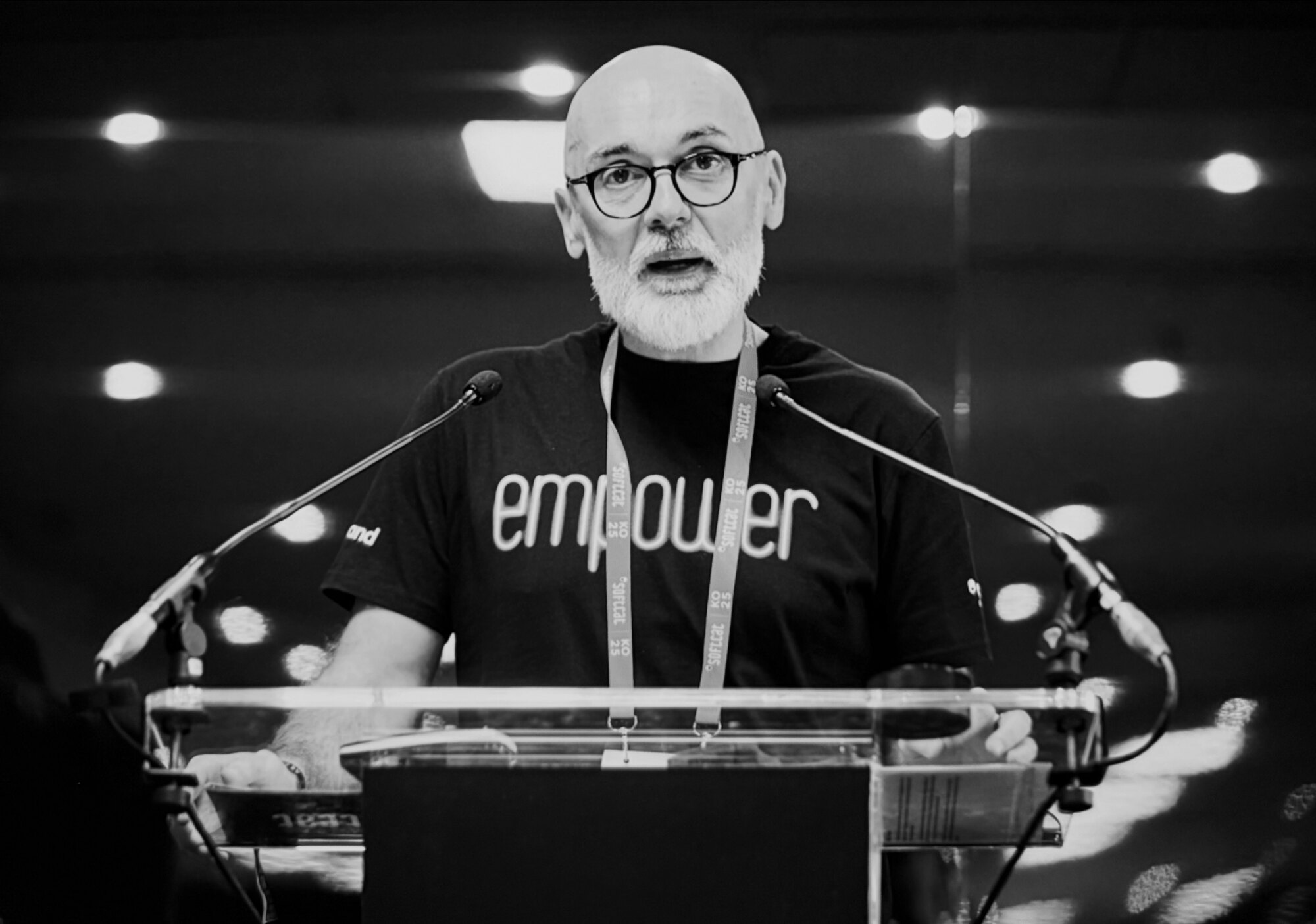 Mark Boyer speaking on stage at a lectern